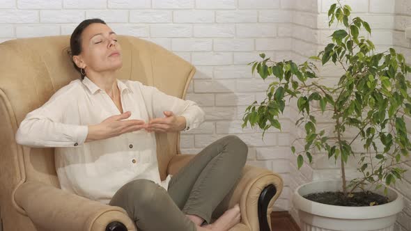 Female Meditation Inhale Yoga in Living Room