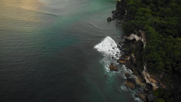 Beautiful Bingin beach with exotic cliffs houses and hotel located in Bali, Indonesia. This drone fo