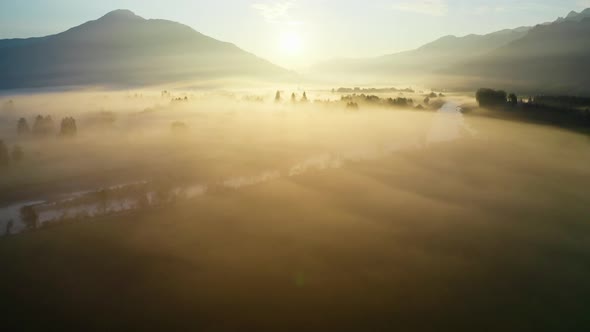 Drone Over Ethereal Misty Landscape Of Zell Am See At Sunrise