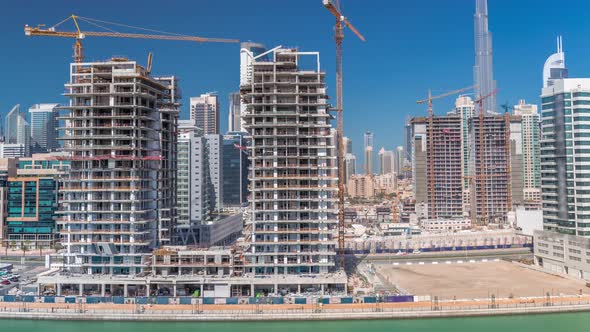 Aerial View of a Skyscrapers Under Construction with Huge Cranes Timelapse in Dubai