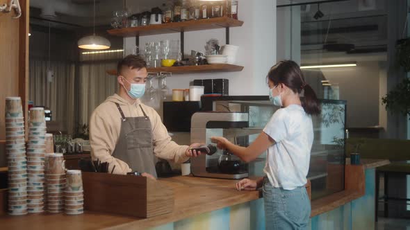 Asian Man in Medical Face Mask in Coffee Shop Lockdown Quarantine Coronavirus is Over Back to Normal