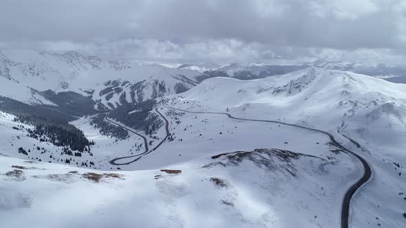 Storm brewing over the peaks on Loveland Pass, Colorado. Aerial views of mountains and highway 6.