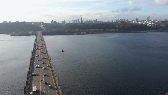 Urban Traffic on a Bridge Over a River, View of the Kiev Pechersk Lavra