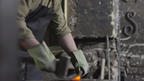 Blacksmith Manually Forging Metal