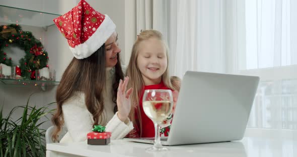 New Year's Concept Mom Her Daughterin Christmas Costumes Make Online Call Laptop