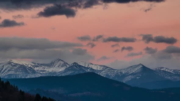 Colorful Evening Sky over Snowy Alpine Mountains