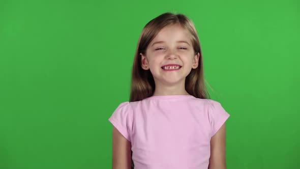 Child Genuinely Smile at the Camera. Green Screen. Slow Motion