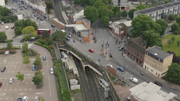 London Town with Pedestrian and Transport Bridge Over Overground Train station