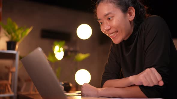 Young Asian woman person using computer laptop videos conference online with friends for education.