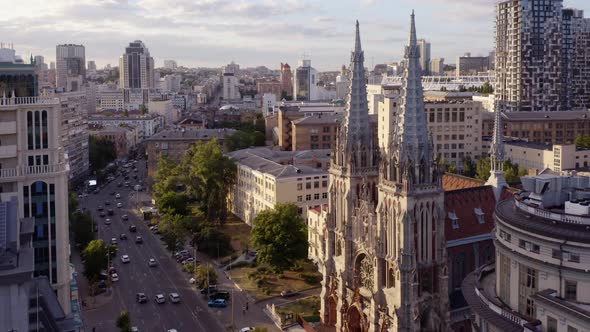 Urban City Scape with Catholic Church and Car Traffic