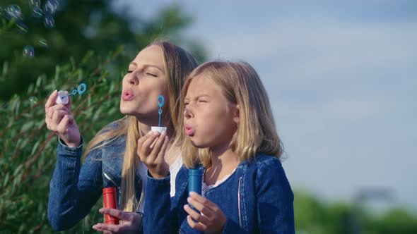 Mom and daughter with bubbles