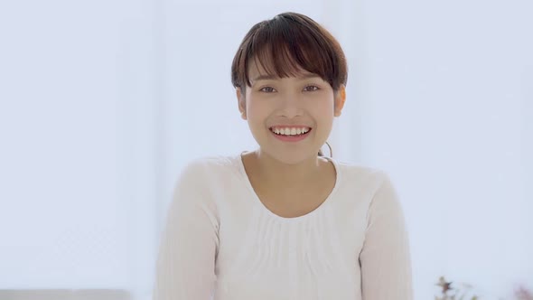 Beautiful portrait young asian woman with smiling and laughing in bedroom.