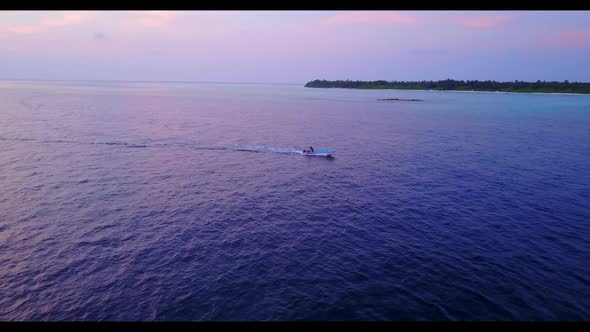 Aerial drone view sky of beautiful coast beach break by aqua blue lagoon and white sandy background 