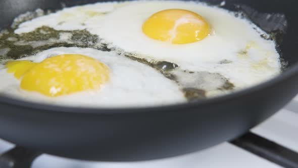 Fried eggs in the pan.