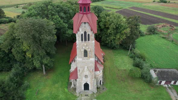 Fly Over the Roman Catholic Church in a Countryside