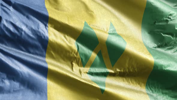 Saint Vincent and the Grenadines textile flag waving on the wind. Slow motion. 20 seconds loop.