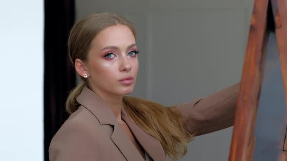 Young Female Blondie Posing Looking in to Camera