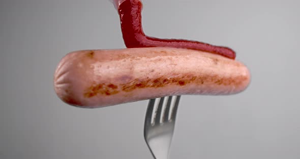 Tomato Hot Sauce Drops To the Sausage in Slow Motion, Tomato Ketchup with Meat, Sausage on Fork, DCI