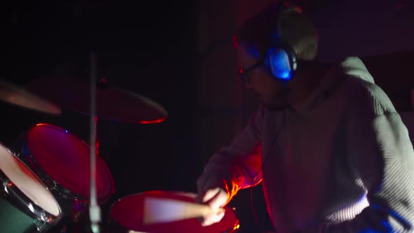 Drummer Playing Drums in the Club