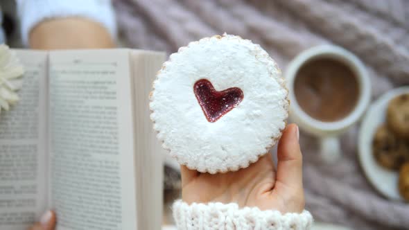 Hand With Festive Heart Cookie For Valentine's Day Or Christmas