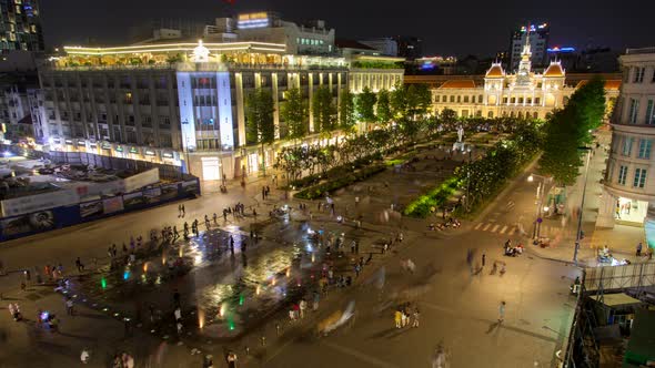 Crowd on Nguyen Hue Pedestrian Street with Statue Ho Chi Minh, Vietnam Timelapse