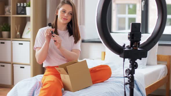 Happy Girl Blogger Unpacking Parcel Box at Home