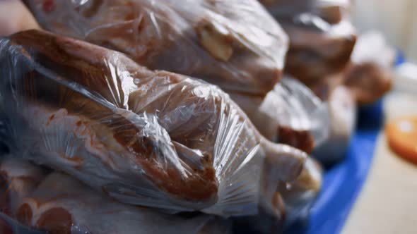 Closeup View of Packed Chicken Legs Into Individual Plastic Bags