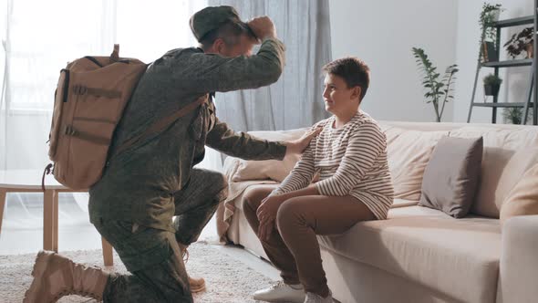 Man Leaving for Deployment and Saying Goodbye to Son