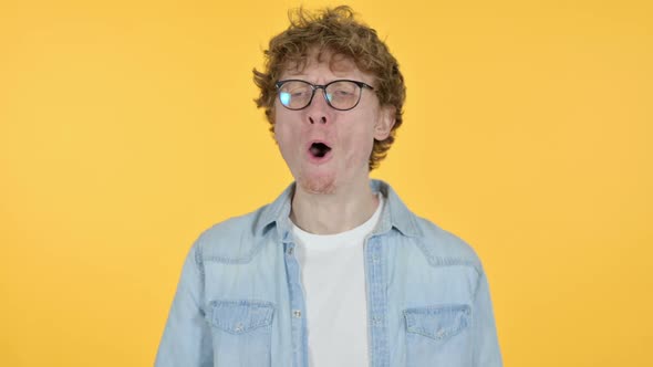 Yawning Redhead Young Man Yellow Background