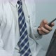 Doctor Writes Something On A Smartphone - VideoHive Item for Sale