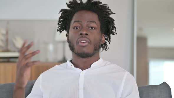 Portrait of Cheerful African Man Doing Video Chat 