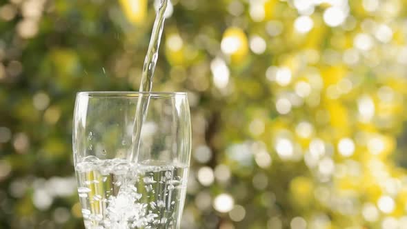 Static Slow Motion Shot of Pouring Drinking Water into a Glass