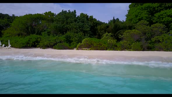 Aerial above travel of marine lagoon beach lifestyle by blue water with bright sand background of a 