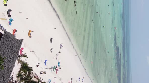 Zanzibar Tanzania  Vertical Video Kitesurfing Near the Shore of Ocean Slow Motion