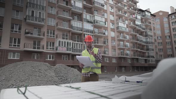 A Male Construction Manager Checks the Quantity and Checks the Construction Matral with Documents at