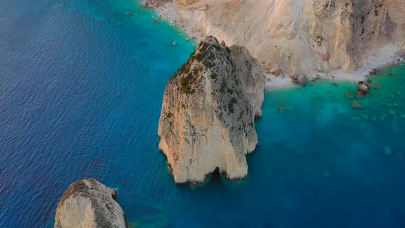 Aerial seascape at the day time. Sea bay and rocks from drone.