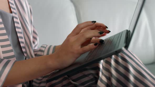 Woman Hands Using Laptop Computer at Home