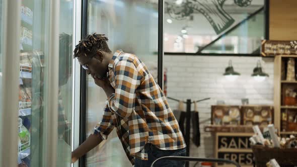 Shopper Talking By Smartphone While Shopping