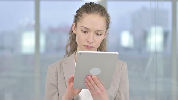 Portrait of Hardworking Young Businesswoman Using Table