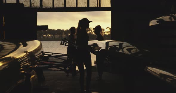 Female rowing team training on a river