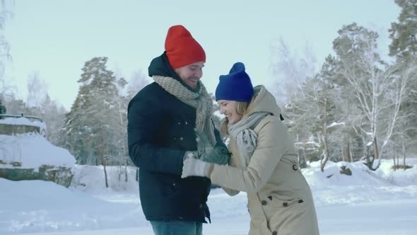 Man Ice Skating with Girlfriend