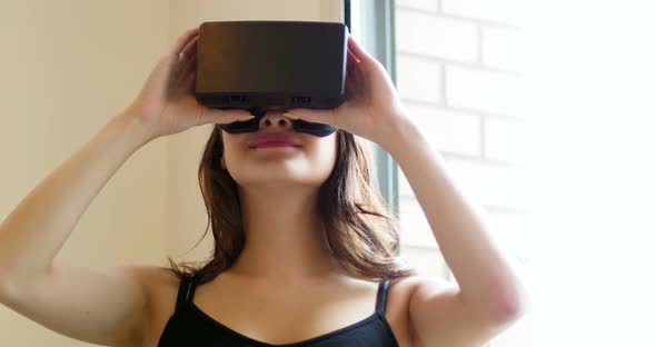 Smiling woman using virtual reality headset