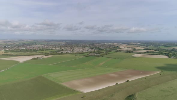 Aerial tracking forward towards the historic town of Dorchester from the south. Old Roman town, with