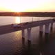 Aerial Shot of a Straight Bridge Over the Dnipro at Golden Sunset in Summer - VideoHive Item for Sale