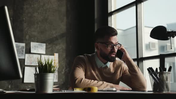 Businessman Is Happy Talking on the Phone. Man Heard Good News