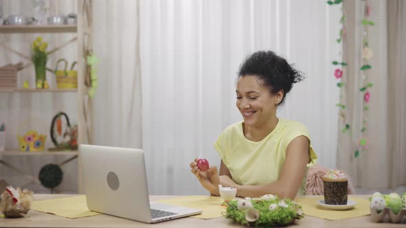 Cute African American Woman Talking By Video Call on Laptop