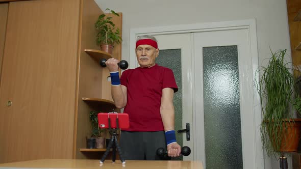 Old Senior Grandfather Man Doing Workout with Dumbbells Training Fitness Sport Activity at Home