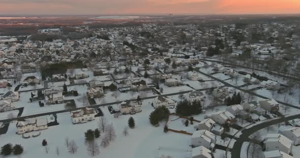 Aerial View Snow Covered Roofs of Houses a Winter Day