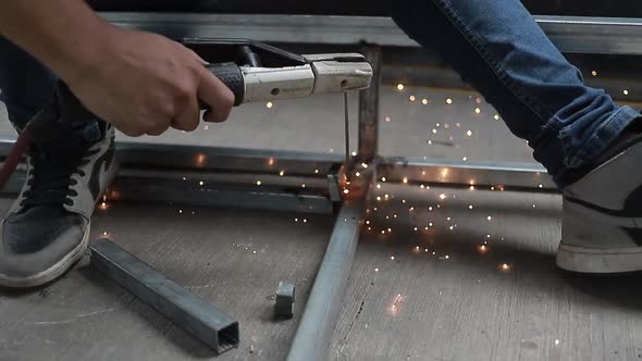 Welder man worker welding steel beam structure. Video Industrial HD