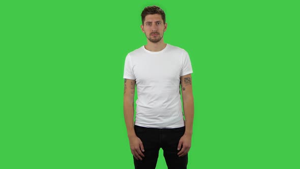Confident Guy Is Looking Straight. Green Screen